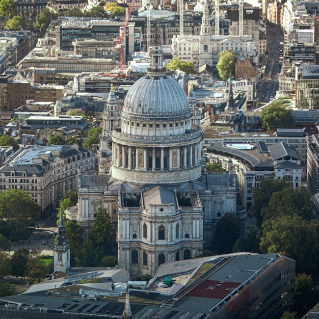 A seamless hexagonal pattern showing architectural details of a cathedral and urban streets in a kaleidoscopic grey and white palette. — base photo: An evocative high-altitude shot by Jimmyk photos, capturing the iconic dome of St. Paul’s Cathedral 