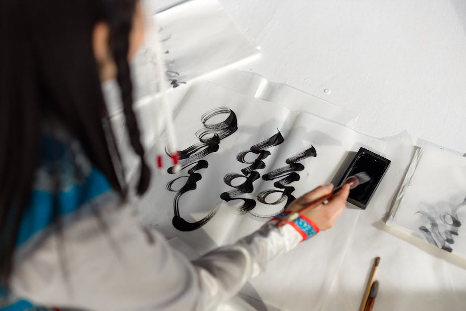 Seamless kaleidoscope wallpaper pattern — Calligraphy by wallpaper⁶ — base photo: An Asian woman creates exquisite Mongolian calligraphy using black ink on paper.