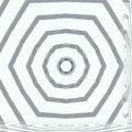 A radial kaleidoscope pattern of amber, gold, and black shards forming a complex geometric mandalic design.