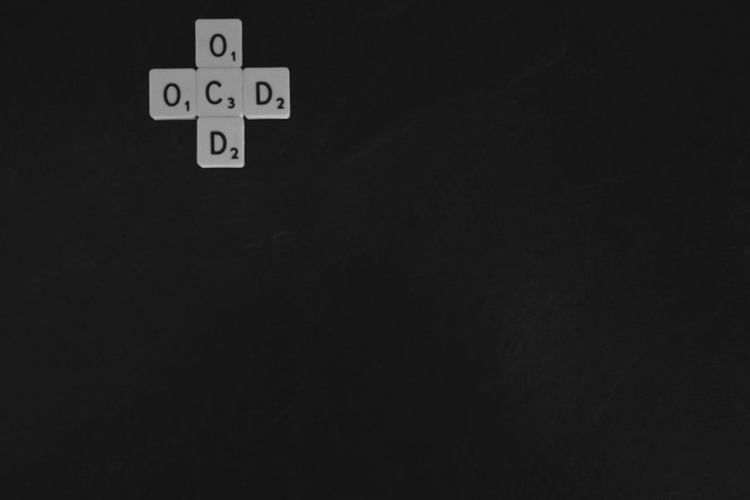 Seamless rotation wallpaper pattern — Algebra by wallpaper⁶ — base photo: The letters OCD in the shape of a cross.