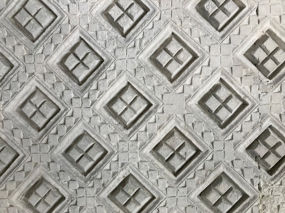 Seamless mirror wallpaper pattern — Geometry by wallpaper⁶ — base photo: a close up of a wall with a pattern on it