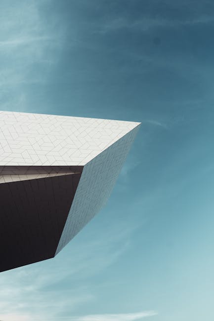 Seamless kaleidoscope wallpaper pattern — Geometry by wallpaper⁶ — base photo: Modern minimalist architecture of the Eye Film Museum against a clear blue sky in Amsterdam.