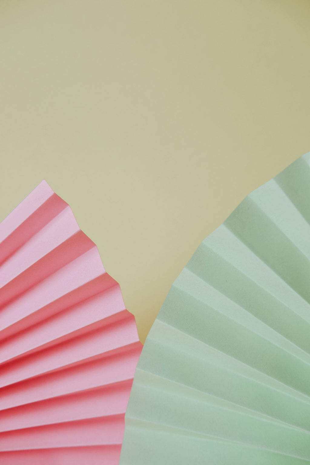 Seamless kaleidoscope wallpaper pattern — Origami by wallpaper⁶ — base photo: a close up of a pink and a green paper fan