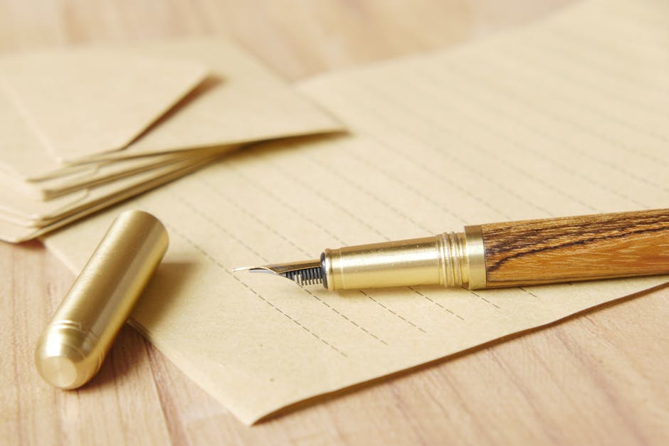Seamless kaleidoscope wallpaper pattern — Calligraphy by wallpaper⁶ — base photo: Close-up of a golden fountain pen resting on lined paper, evoking classic correspondence.