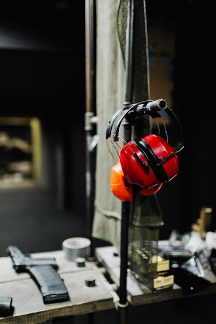 Seamless diamond wallpaper pattern — Glitch by wallpaper⁶ — base photo: Red earmuffs on display at an indoor shooting range, emphasizing safety gear importance.