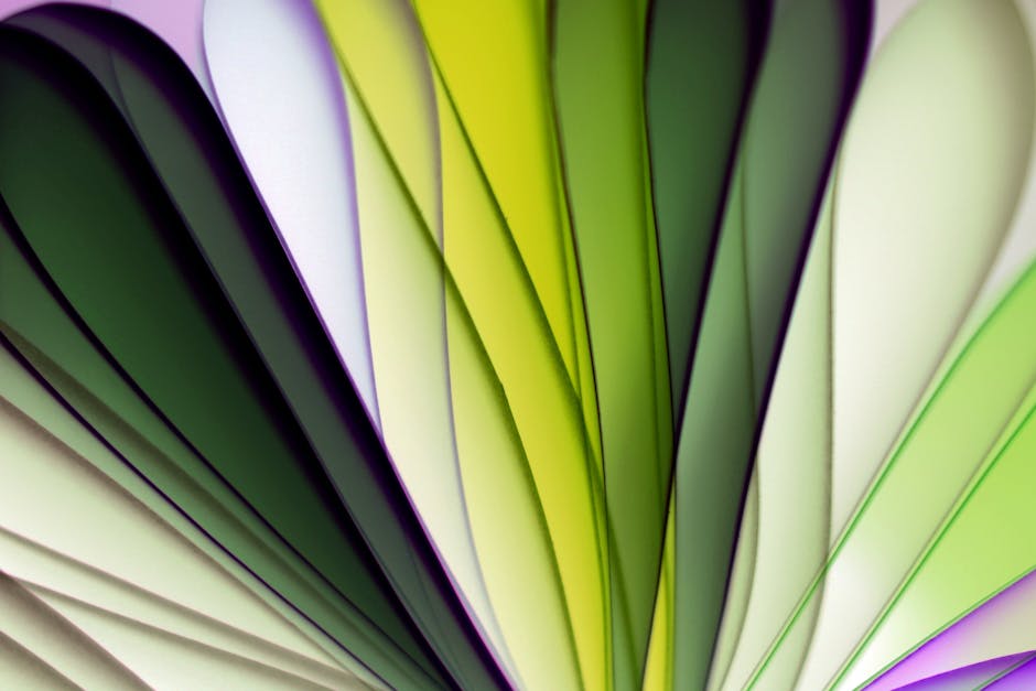Seamless kaleidoscope wallpaper pattern — Origami by wallpaper⁶ — base photo: Vibrant abstract composition of layered paper in green, white, and purple hues.