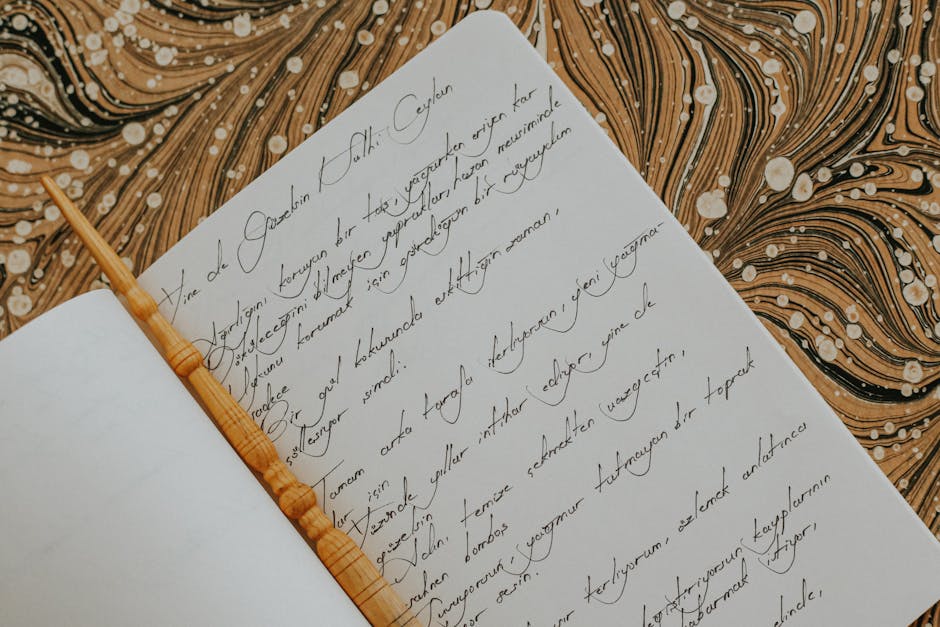 Seamless mirror wallpaper pattern — Calligraphy by wallpaper⁶ — base photo: A beautifully written calligraphy page with an intricate marbled background and a carved wooden pen.