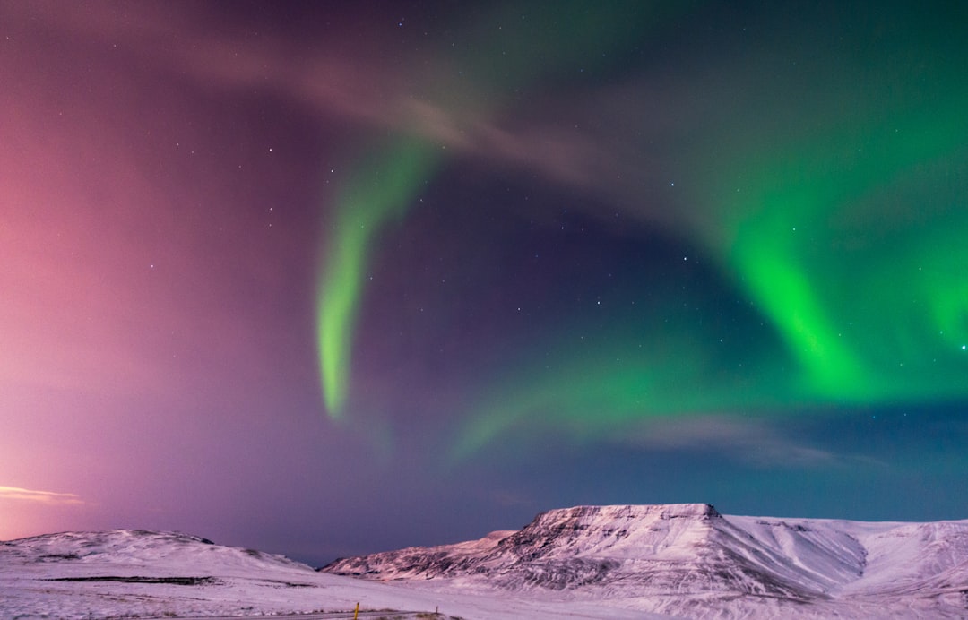 Seamless kaleidoscope wallpaper pattern — Astronomy by wallpaper⁶ — base photo: Beautiful winter view of Reykjavik, Iceland and the Northern Lights and auroras with snowcapped moun