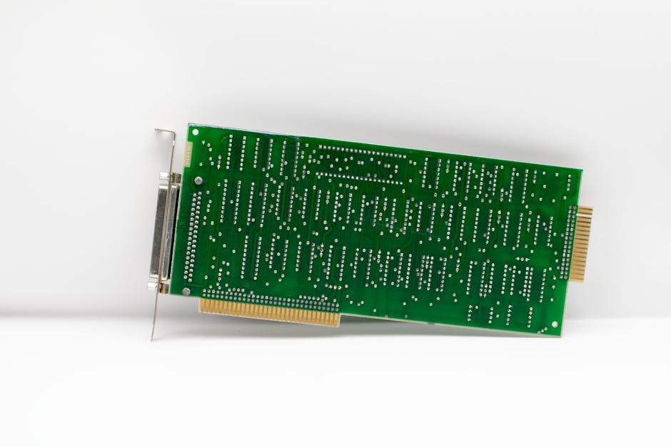 Seamless kaleidoscope wallpaper pattern — Glitch by wallpaper⁶ — base photo: A vintage green circuit board showcasing electronic components, isolated on a white background.