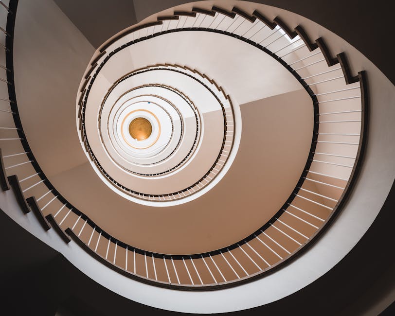 Seamless mirror wallpaper pattern — Algebra by wallpaper⁶ — base photo: An artistic view of a spiral staircase showcasing modern architectural design.