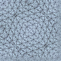 Close-up of a large origami tessellation structure with many lines, showcasing a complex geometric pattern in diamond symmetry.