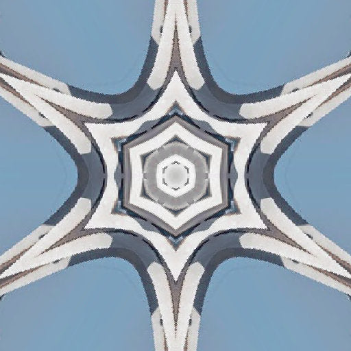 A radial kaleidoscope pattern featuring shades of blue and white glass panels in a symmetrical star-like formation.