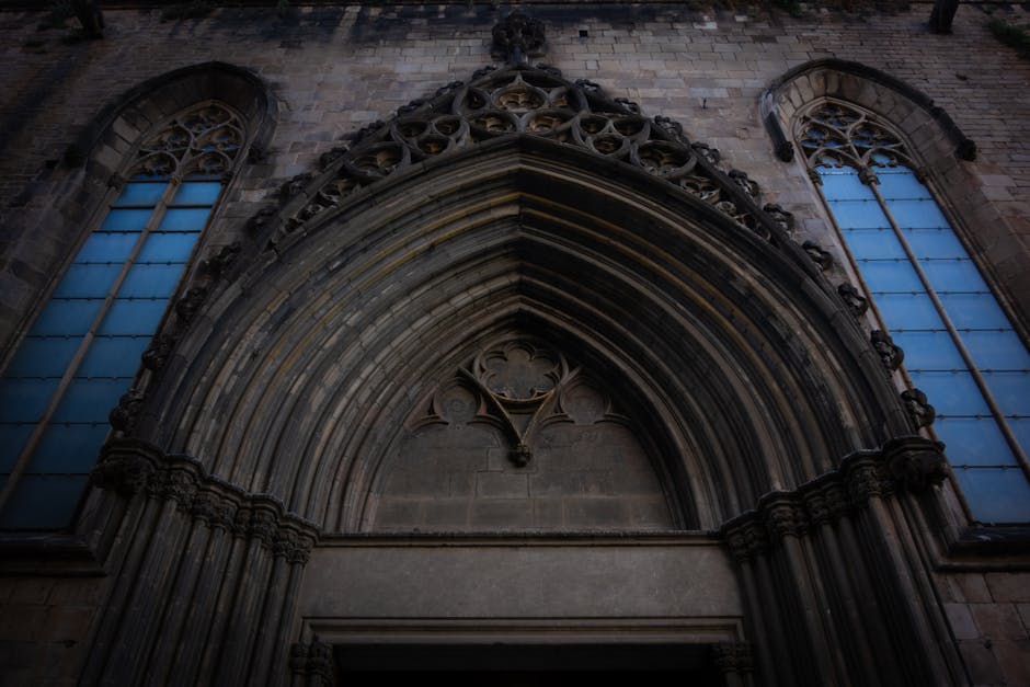 Geometric pattern inspired by Gothic cathedral stained glass windows, featuring a Hex symmetry. — base photo: A dramatic low-angle shot of a large, ornate Gothic cathedral entrance. Sunlight streams through the