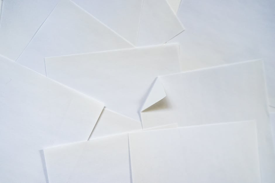 Seamless mirror wallpaper pattern — Origami by wallpaper⁶ — base photo: Artistic minimalist composition of overlapping white paper sheets.