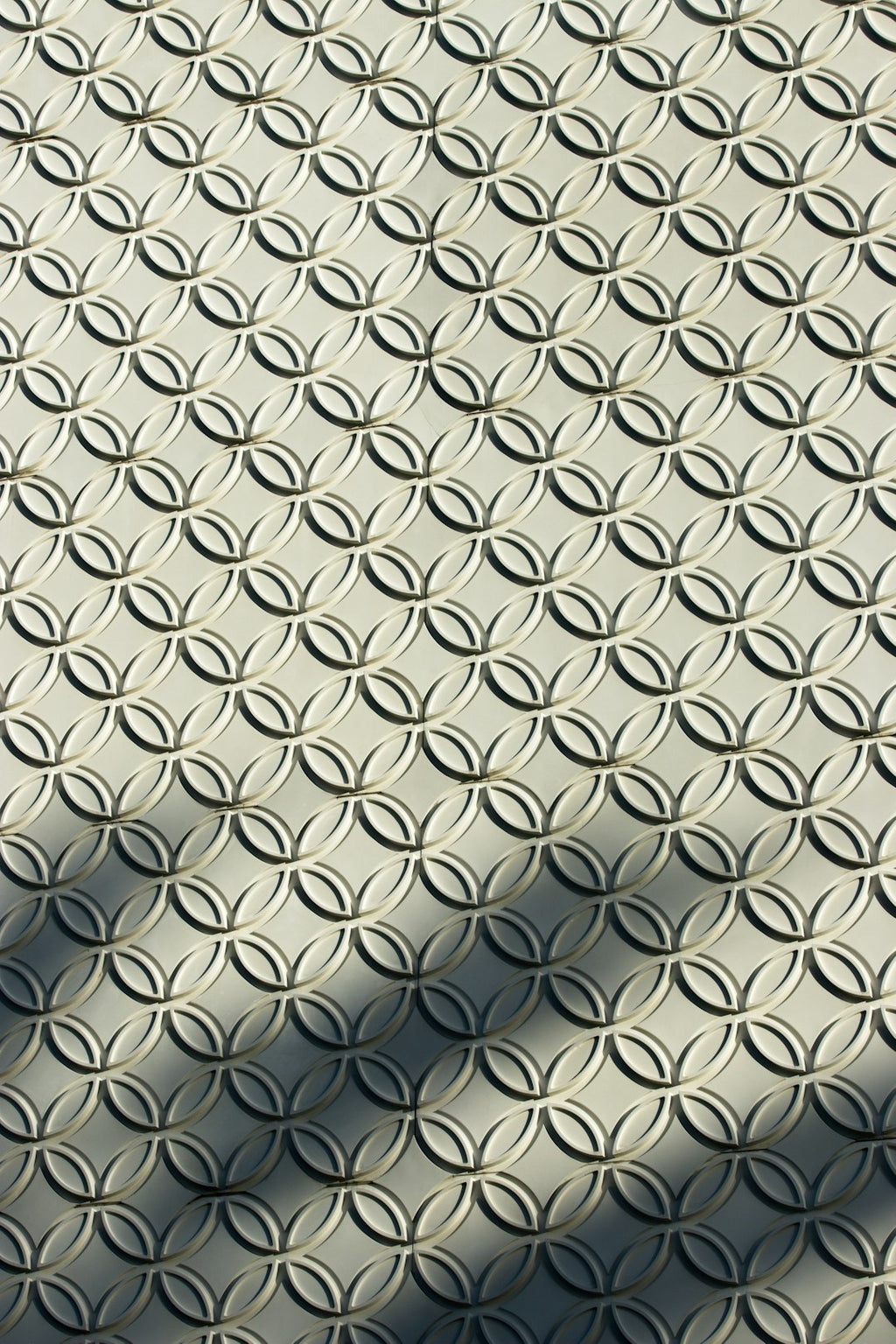 Seamless mirror wallpaper pattern — Origami by wallpaper⁶ — base photo: a shadow of a person walking on a sidewalk