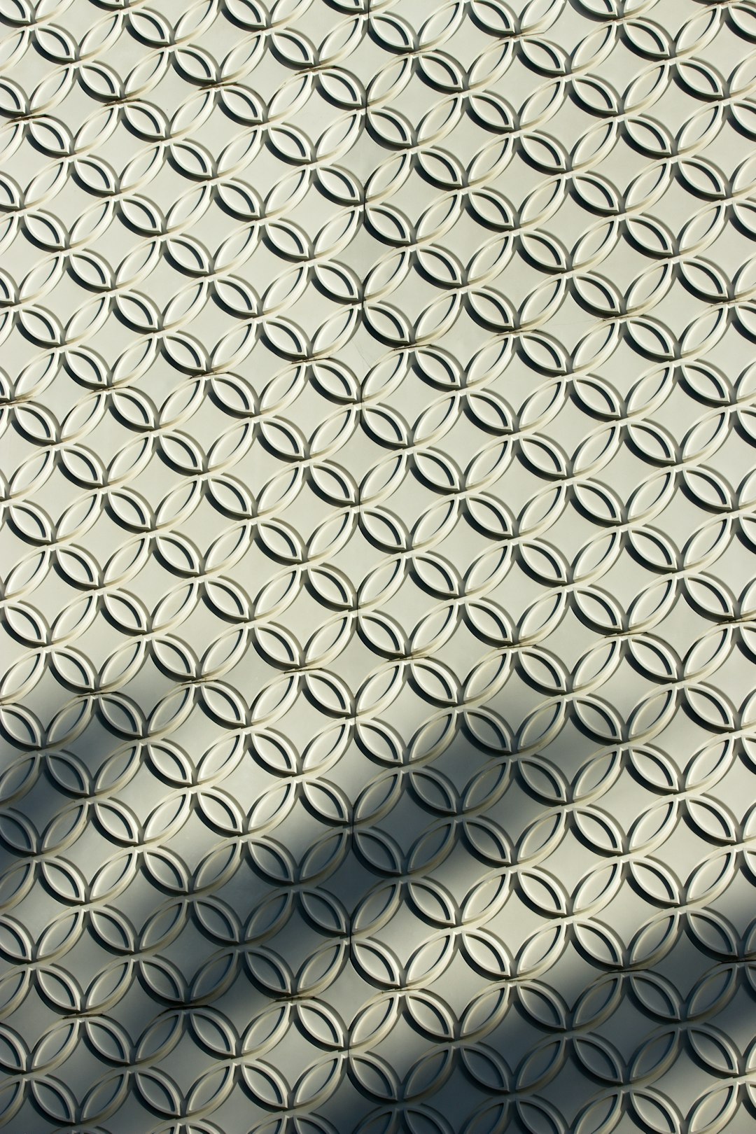 Seamless mirror wallpaper pattern — Origami by wallpaper⁶ — base photo: a shadow of a person walking on a sidewalk
