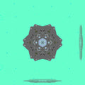 Seamless repeat pattern of mineralogy fragments in a kaleidoscope arrangement, resembling gemstone facets on wallpaper.