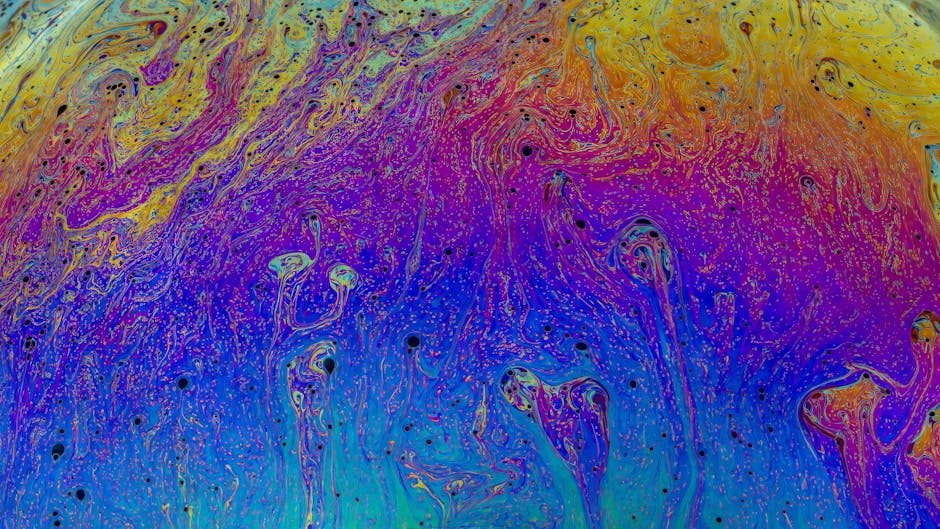 Vibrant, multicolored abstract liquid swirls in a seamless Hex pattern, designed by Rafael Minguet Delgado. — base photo: A close-up view of the abstract liquid swirl texture, showcasing vibrant, multicolored patterns. The