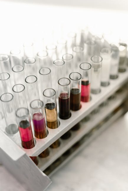 Seamless hex wallpaper pattern — Medicine by wallpaper⁶ — base photo: A close-up view of test tubes with colorful liquids in a laboratory environment.