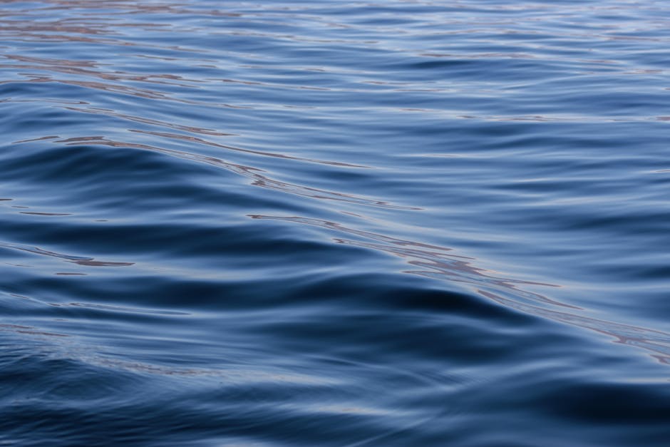 Seamless mirror wallpaper pattern — Cartography by wallpaper⁶ — base photo: Serene ocean waves with smooth reflections create a tranquil seascape.