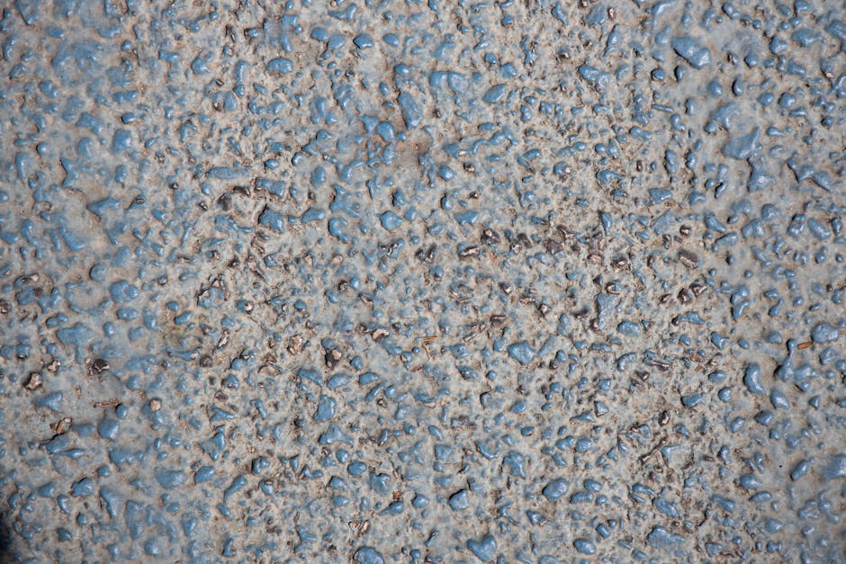 Physics Pinwheel wallpaper pattern — base photo: Close-up of a textured granite surface, showcasing roughness with visible pebbles for background use