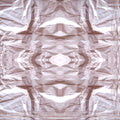 Crinkled paper texture repeating in a mirror symmetry pattern, showcasing the subtle details of paper folds and shadows.