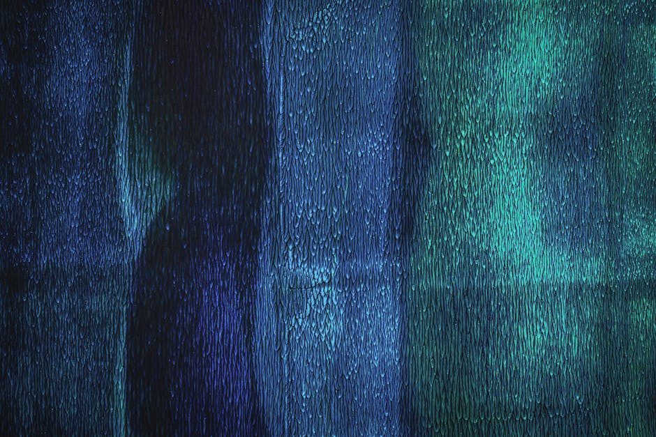 Seamless diamond wallpaper pattern — Glitch by wallpaper⁶ — base photo: Close-up abstract image showcasing texture and patterns in blue and turquoise hues.