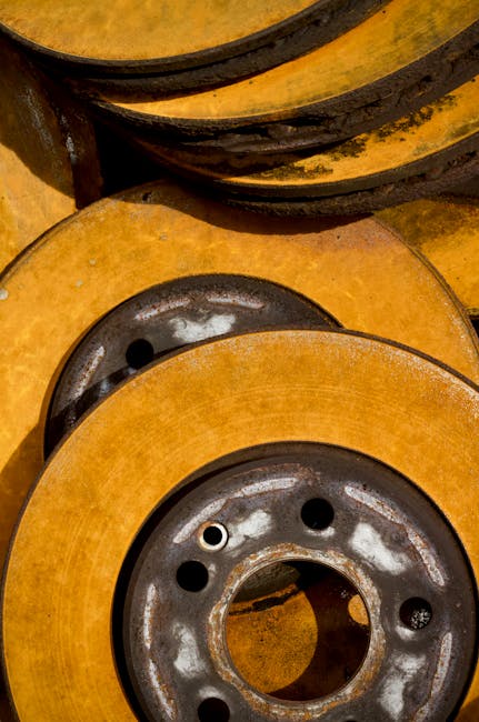 Seamless kaleidoscope wallpaper pattern — Calligraphy by wallpaper⁶ — base photo: Detailed close-up of rusty brake discs showcasing texture and color.