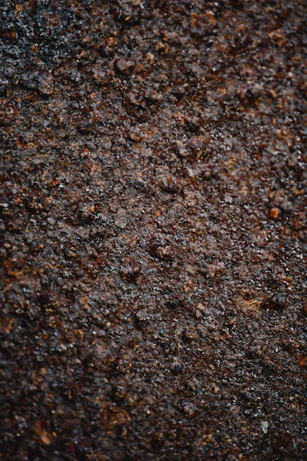 Physics Kaleidoscope wallpaper pattern — base photo: Detailed close-up of a textured and rough rusty surface, ideal for backgrounds.