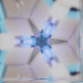 A repeating dark gray pattern of 3D cubes in hexagonal symmetry creating an isometric architectural effect.