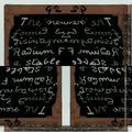 A staggered brick pattern of vintage white scientific equations and chemical notations on a dark chalkboard background.