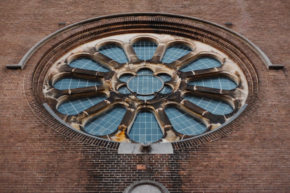 Geometric Hex pattern resembling a cathedral rose window with intricate stained glass details and vibrant jewel tones. — base photo: A striking low-angle shot captures the essence of a historic cathedral's rose window. The intricate 