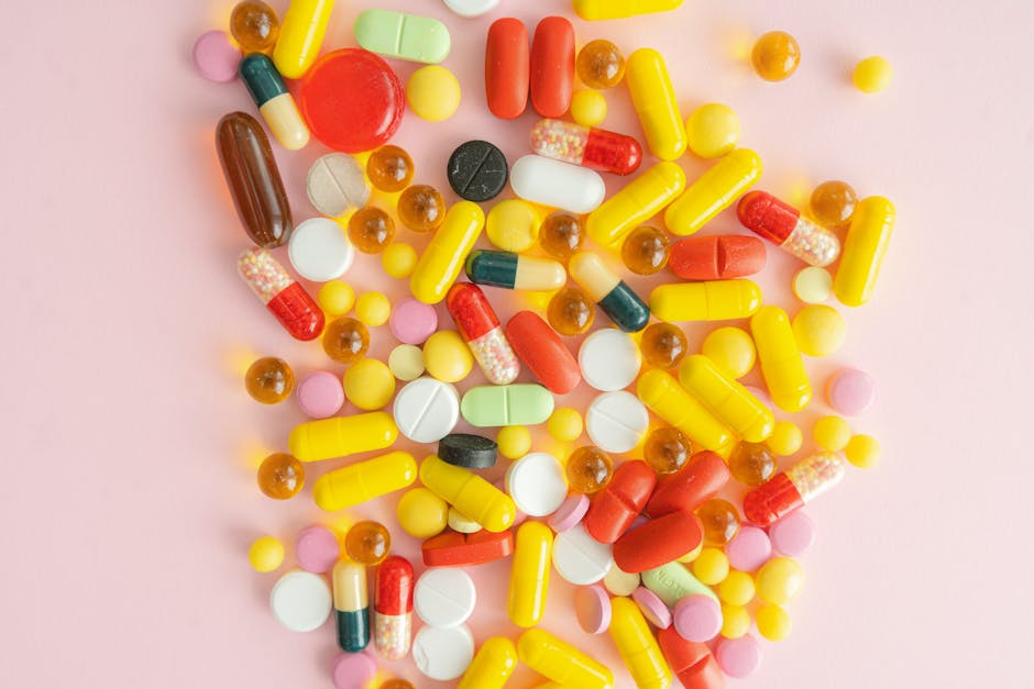 Seamless hex wallpaper pattern — Biochemistry by wallpaper⁶ — base photo: A vibrant collection of diverse pills and capsules scattered on a pink surface.