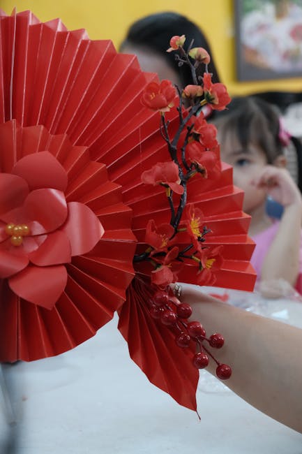 Seamless mirror wallpaper pattern — Origami by wallpaper⁶ — base photo: Close-up of a red decorative fan with flowers, perfect for festive and artistic themes.