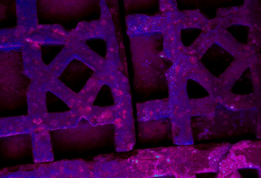 Seamless kaleidoscope wallpaper pattern — Geometry by wallpaper⁶ — base photo: A close-up of an ornate sandstone lattice with repeating geometric shapes