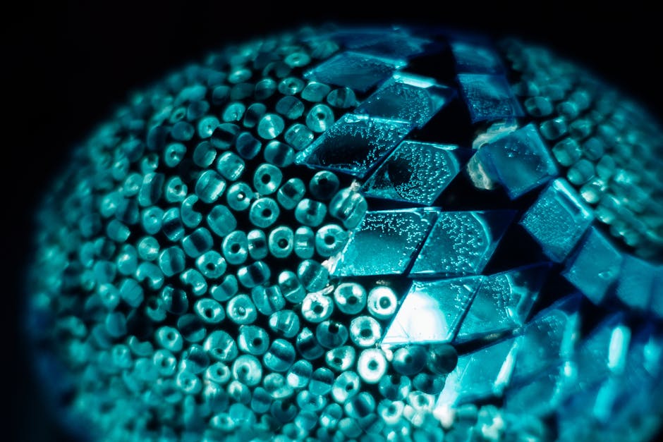 Seamless kaleidoscope wallpaper pattern — Origami by wallpaper⁶ — base photo: Artistic abstract close-up of turquoise beads and crystal pattern with geometric shapes.