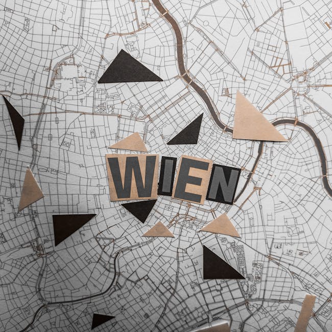 Seamless kaleidoscope wallpaper pattern — Geometry by wallpaper⁶ — base photo: Abstract top view of Vienna map with artistic geometric cutouts, highlighting 'Wien.'