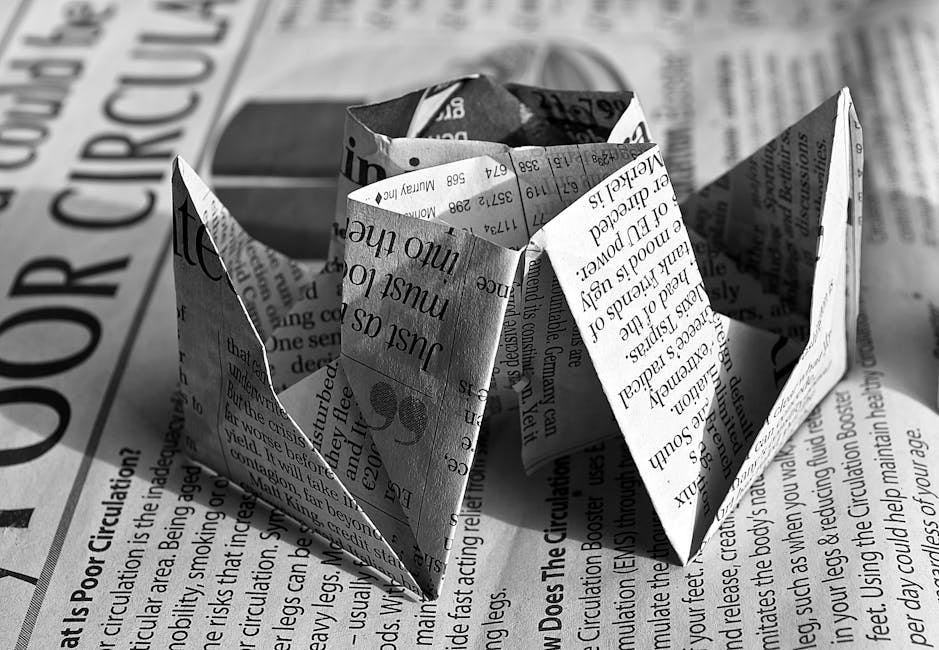 Seamless kaleidoscope wallpaper pattern — Origami by wallpaper⁶ — base photo: Black and white origami rose crafted from newspaper text, showcasing artistic creativity.