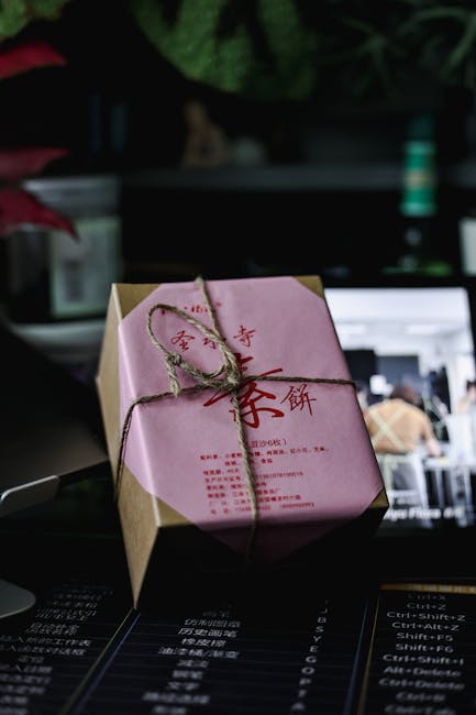 Seamless kaleidoscope wallpaper pattern — Origami by wallpaper⁶ — base photo: Elegant Asian gift box with pink wrapping and twine tie in a creative indoor setup.