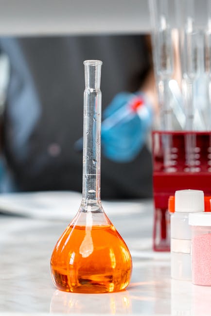 Seamless mirror wallpaper pattern — Biochemistry by wallpaper⁶ — base photo: A close-up shot of a laboratory flask with orange liquid, highlighting scientific research equipment
