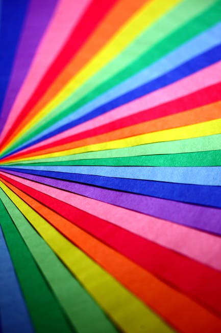Seamless diamond wallpaper pattern — Origami by wallpaper⁶ — base photo: Colorful abstract composition of overlapping rainbow papers creating a vibrant spectrum.