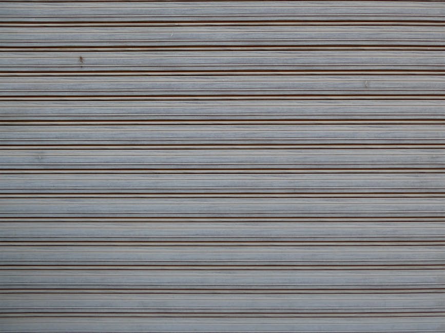 Seamless mirror wallpaper pattern — Origami by wallpaper⁶ — base photo: Close-up of a gray metal shutter with repeated horizontal lines, creating a striped pattern.
