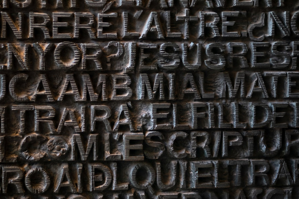 Seamless mirror wallpaper pattern — Calligraphy by wallpaper⁶ — base photo: a close up of a sign with Harpa in the background