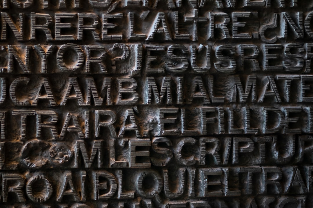 Seamless mirror wallpaper pattern — Calligraphy by wallpaper⁶ — base photo: a close up of a sign with Harpa in the background