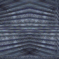 Close-up of textured metal surface with grayscale lines arranged in a brick pattern, inspired by AI transformer technology.