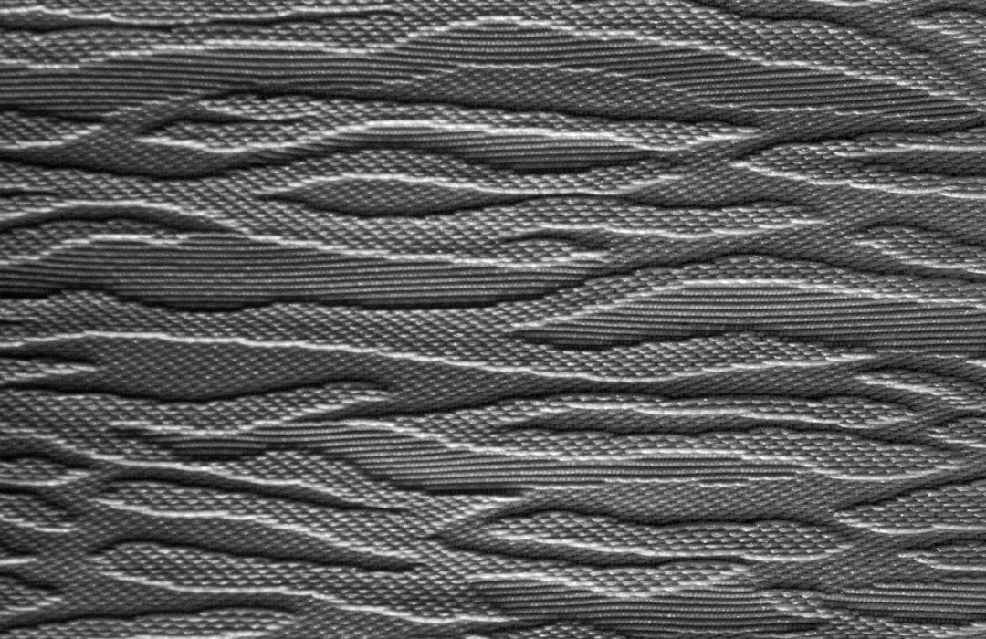 3D Brick wallpaper pattern — base photo: Textured gray fabric with abstract wavy pattern