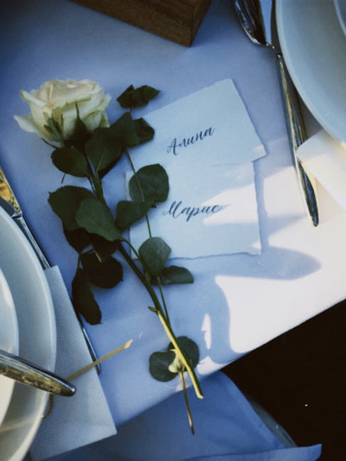 Seamless kaleidoscope wallpaper pattern — Calligraphy by wallpaper⁶ — base photo: An elegant table setup featuring a white rose with personalized name cards on a dining table.