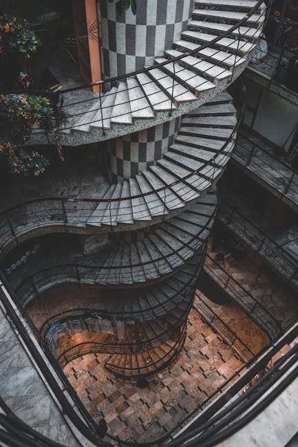 Seamless hex wallpaper pattern — Geometry by wallpaper⁶ — base photo: Stunning high angle view of a spiral staircase with intricate architectural design.