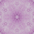 A vibrant digital kaleidoscope pattern with blue and orange geometric shards reflecting in a symmetrical radial starburst.