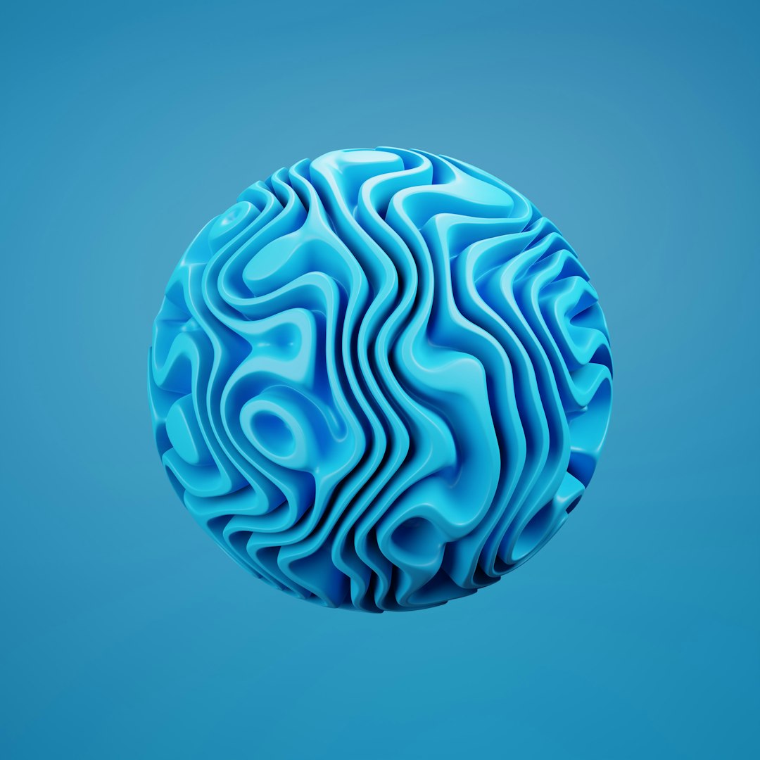 A seamless wallpaper pattern featuring a blue torus shape repeating in a pinwheel symmetry, creating a swirling blue vortex effect. — base photo: A high-speed photograph by Arijit Anand featuring a vibrant blue toroidal object captured mid-flight